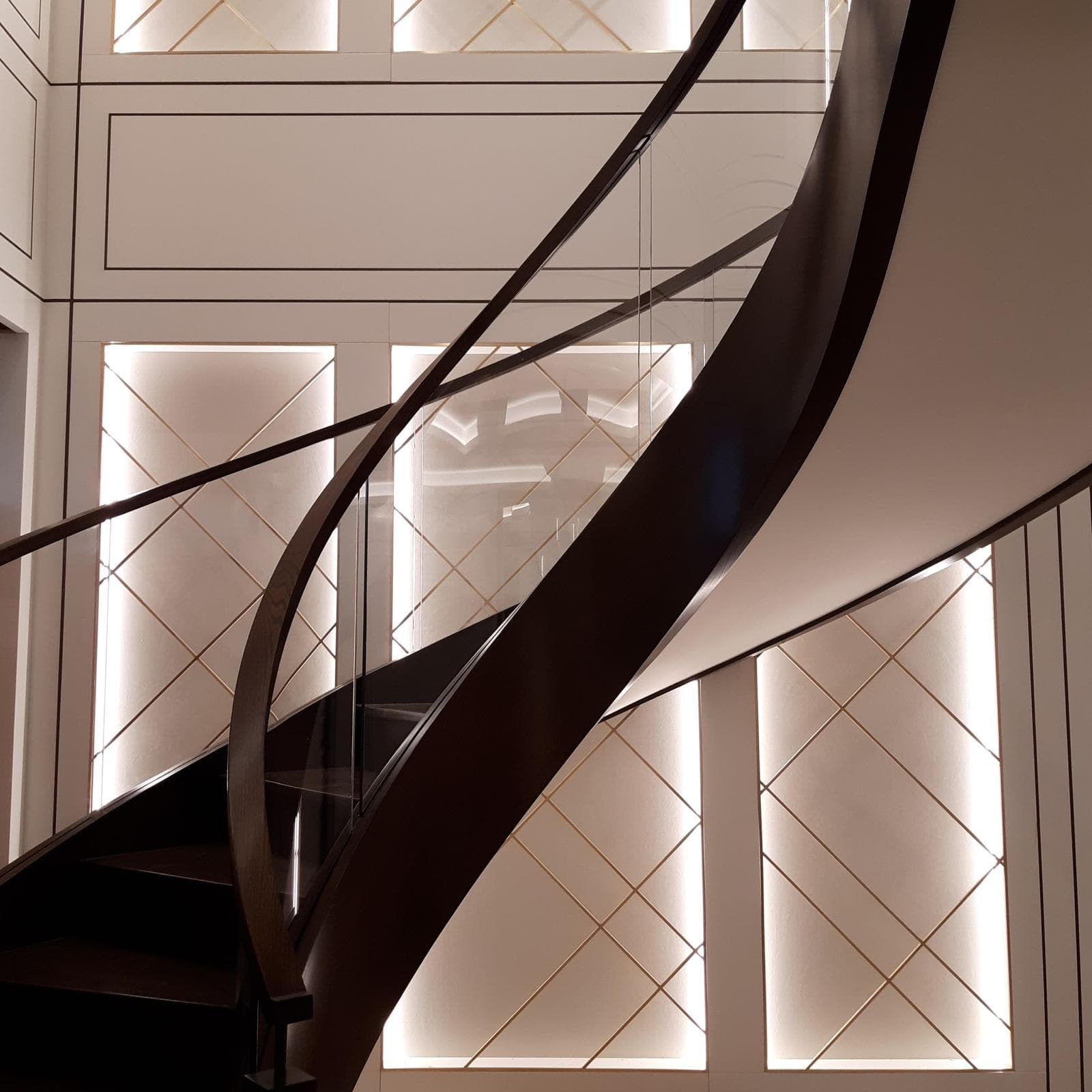 Spiral Staircase & Backlit Geometric Lattice